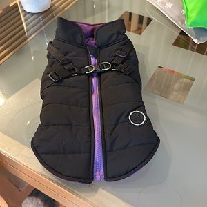 Black dog coat with purple fleece lining inside to keep your dog really warm.